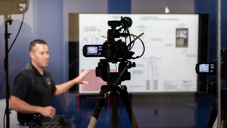 Trainer doing a demonstration on camera.