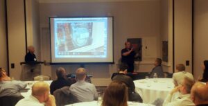 Mike Hoff Demonstrating an AR Solution from Index AR Solutions at EUCI Symposium